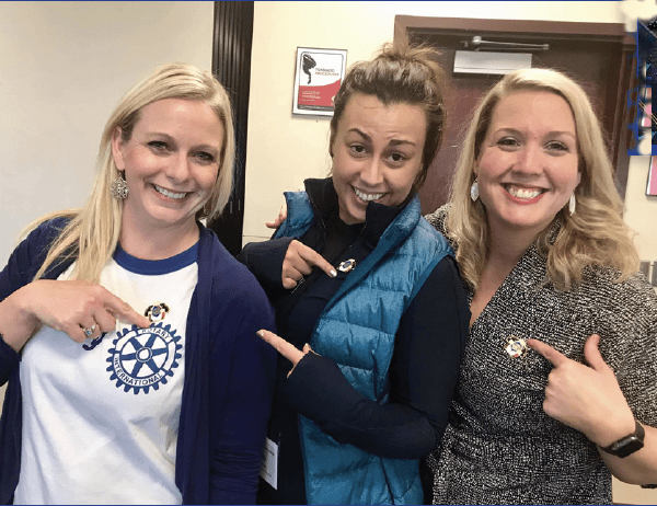 three women promoting Rotary